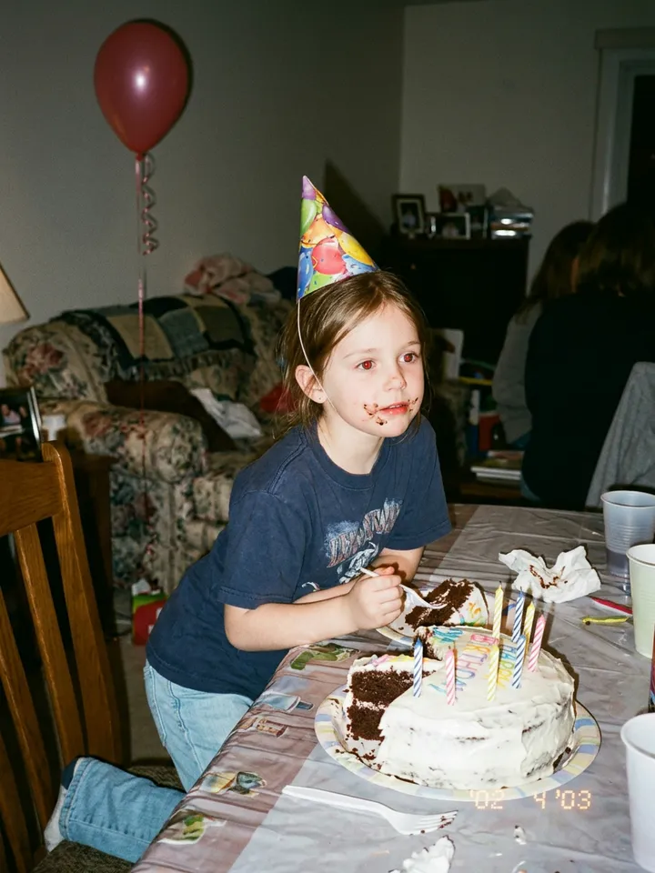 Slide 5: the real photo, messy hair and frosting on her face